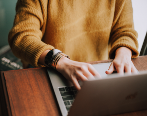 a person typing on a laptop